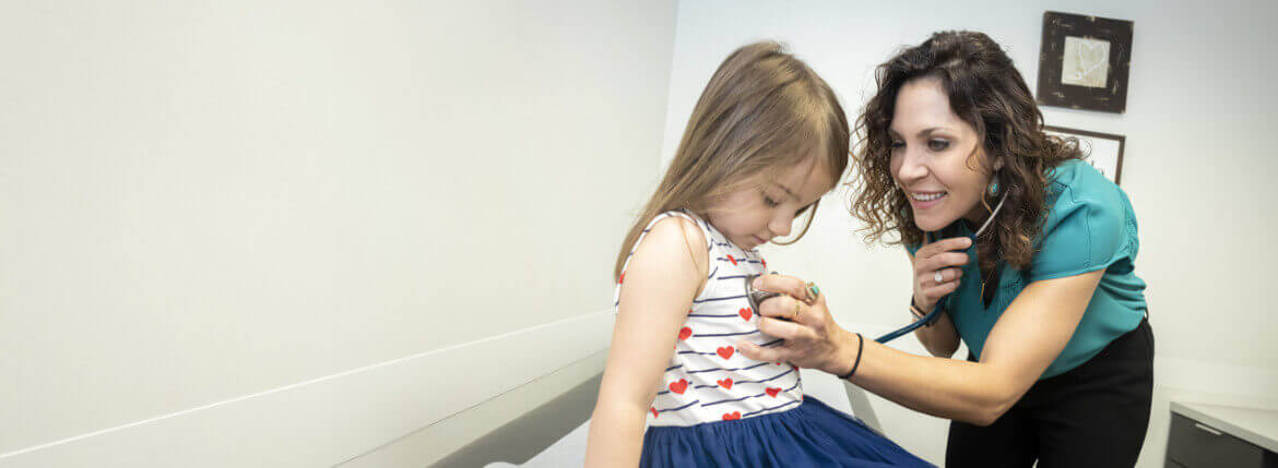 PHS Employee working with a child.